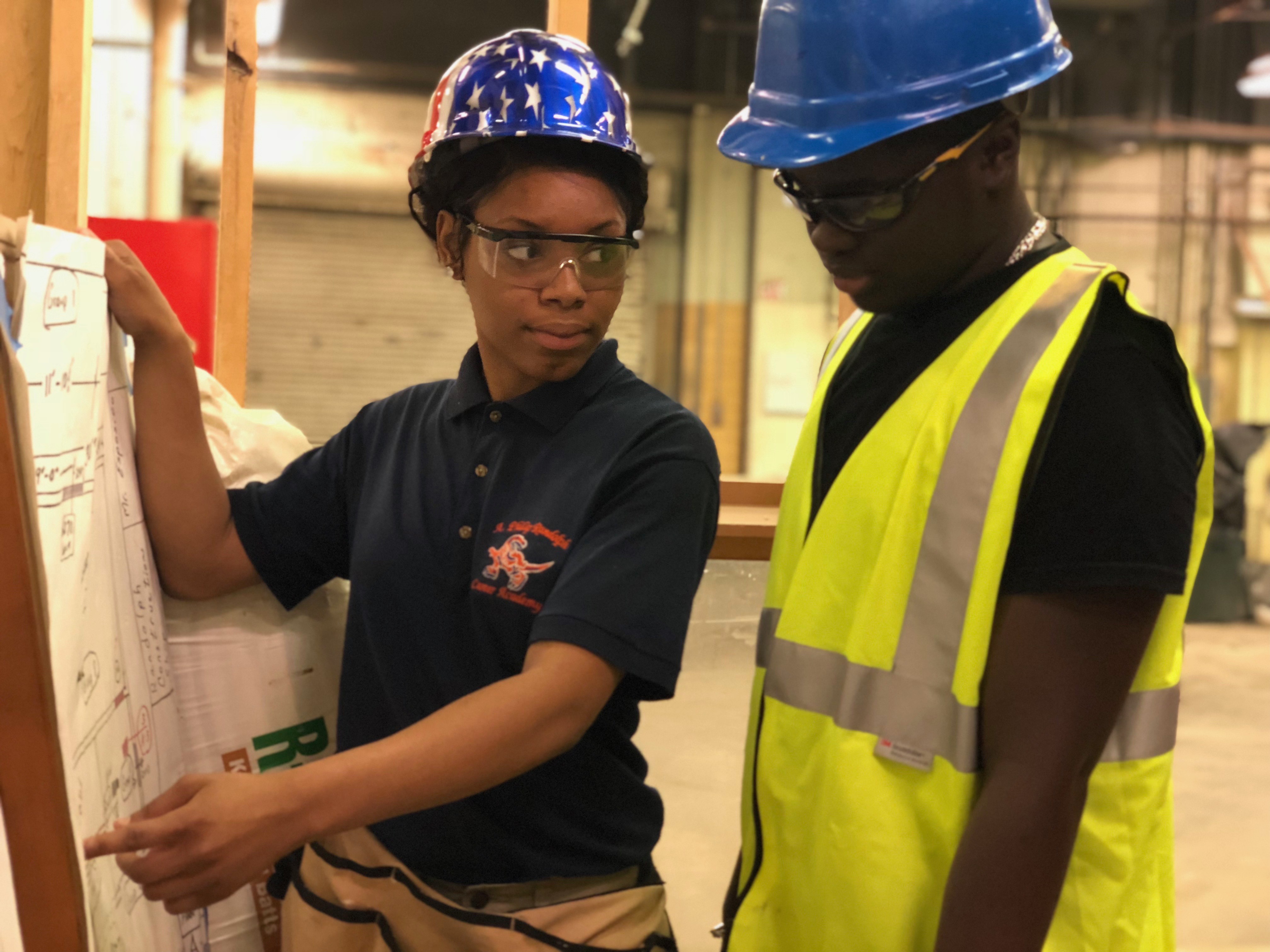 Construction students apply their knowledge to building in the real world.